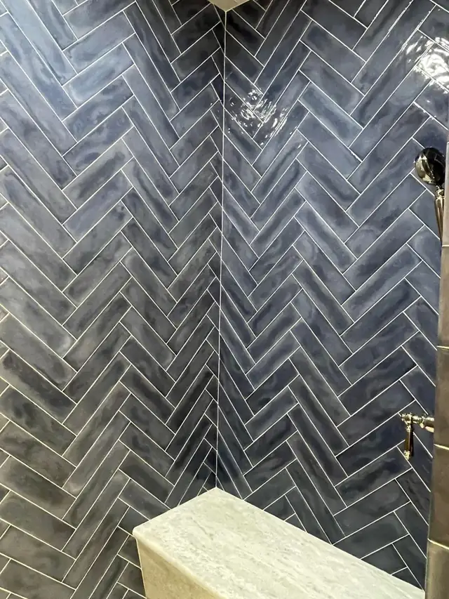 Navy blue herringbone tile wall